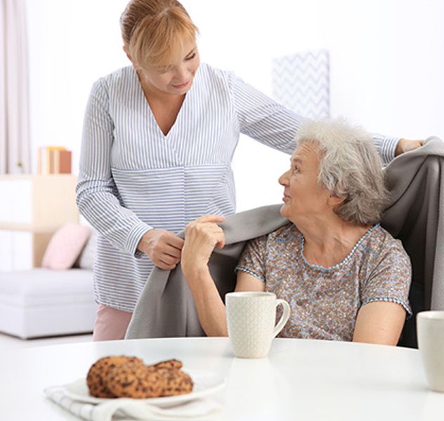 Caregiver helping with household tasks